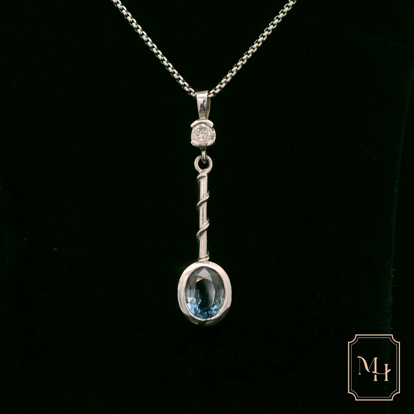 Elegant Silver Pendant with Blue Gemstone