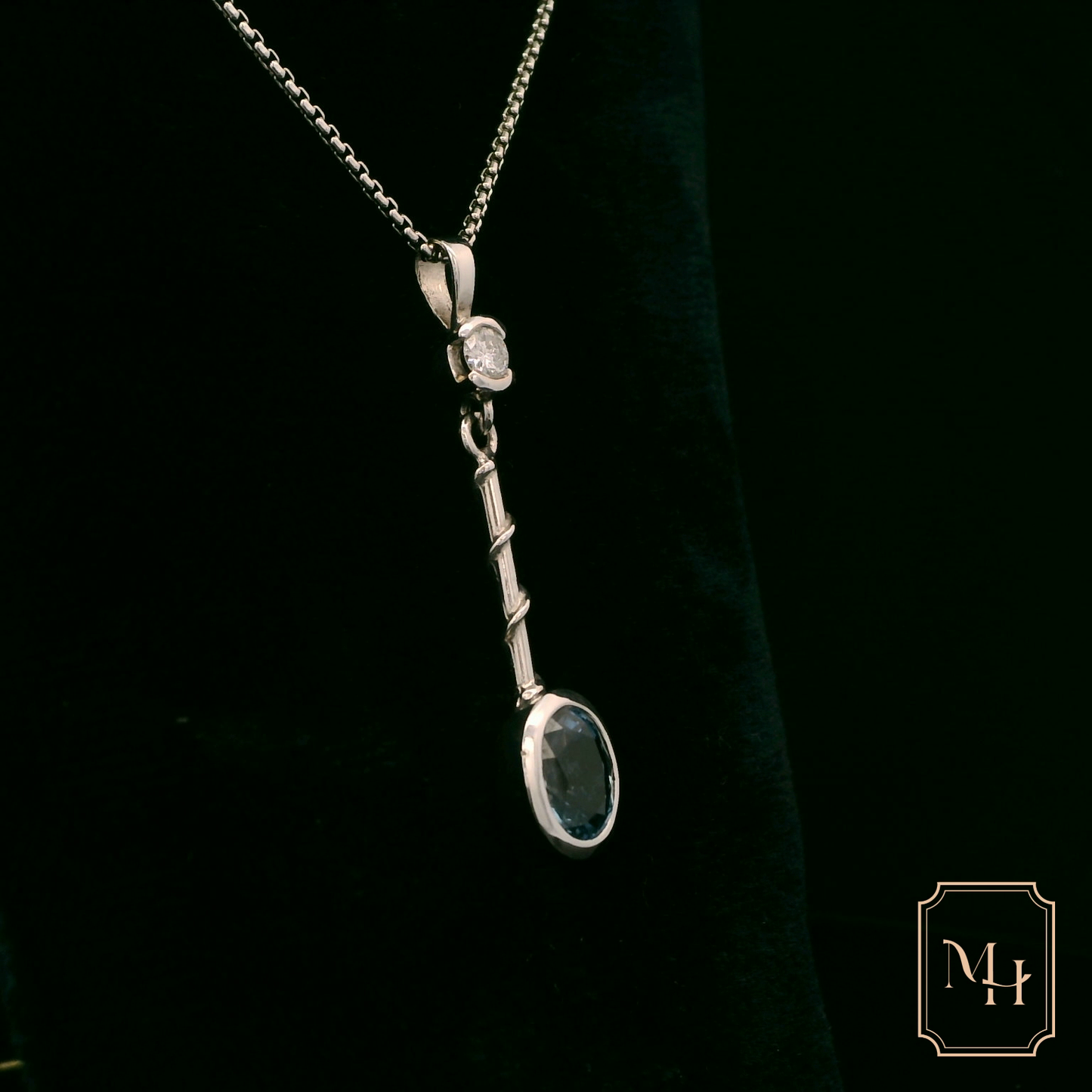 Elegant Silver Pendant with Blue Gemstone