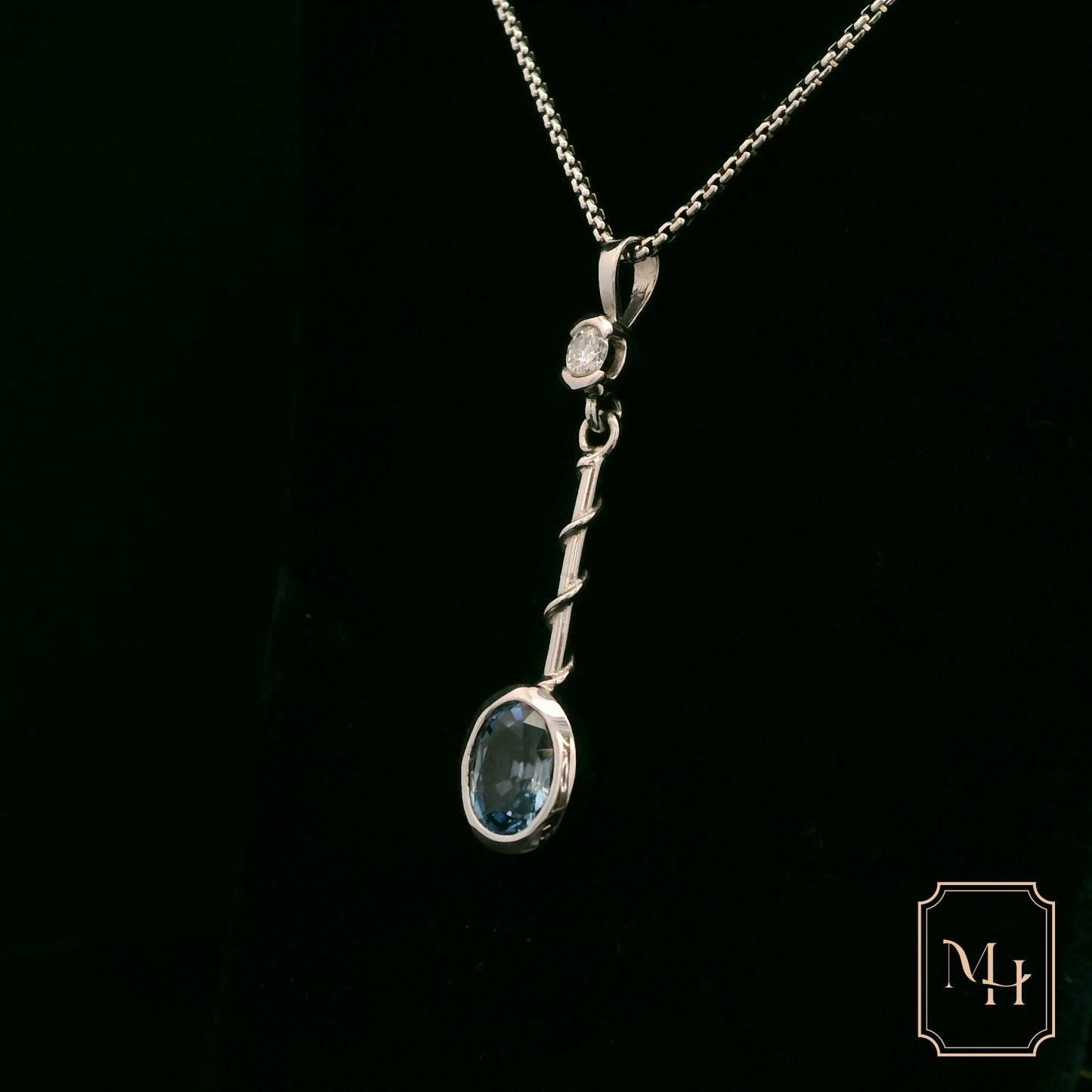 Elegant Silver Pendant with Blue Gemstone